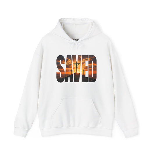 Shop the Saved — By the Cross Christian Hoodie. Simple, powerful, and unmistakably Christian. The word SAVED reveals the scene of Calvary within the letters.